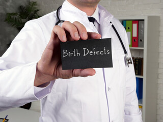 health care concept meaning birth defects with sign on the page.