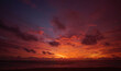© BUDDEE - Nature background. Shot of Landscape amazing of red sky sunset in the sea with red clouds background. Travel concept.