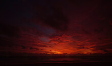 Nature Background. Shot Of Landscape Amazing Of Red Sky Sunset In The Sea With Red Clouds Background. Travel Concept.