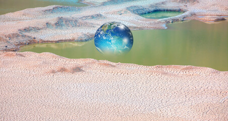 Poster - Global warming concept - Glass Globe (Planet Earth) on dry soil 