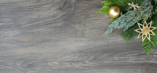 christmas decoration banner with branches and matte golden bauble and straw star decorations - copy 