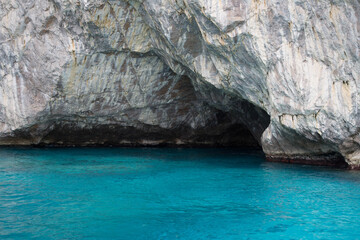 Wall Mural - Cave at the blue water of capri