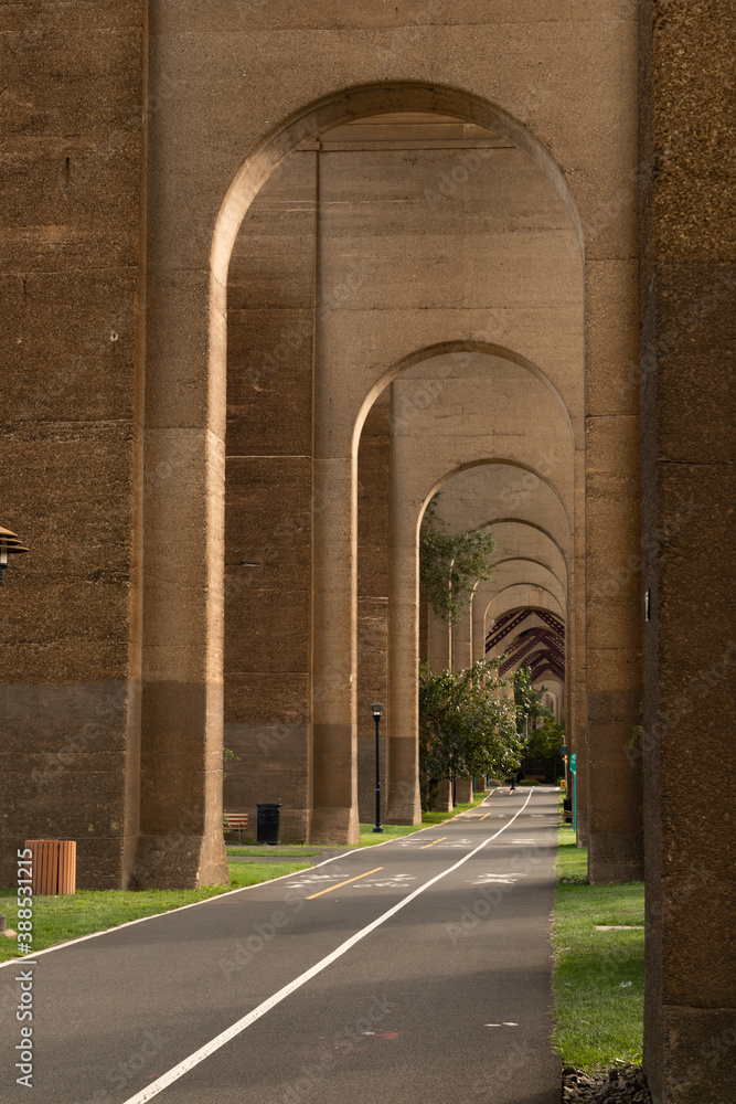 Tall Row of Arches with a Diminishing Perspective above a Pedestrian ...