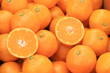 Wall Mural - Sliced ​​oranges at the market.