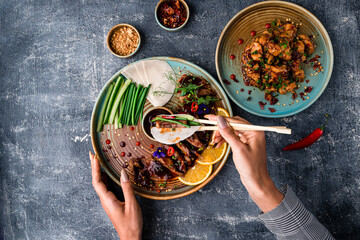 Canvas Print - a woman eats a Peking duck