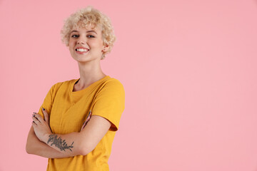 Young casual smiling woman standing isolated