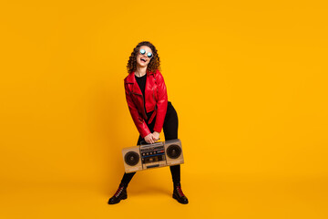 Canvas Print - Full length body size view of pretty cheerful glad wavy-haired girl carrying player having fun isolated bright yellow color background