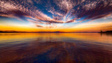 Fototapeta  - sunset panorama reflected over the water