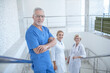 © zinkevych - Team of smiling medical workers standing on stairs