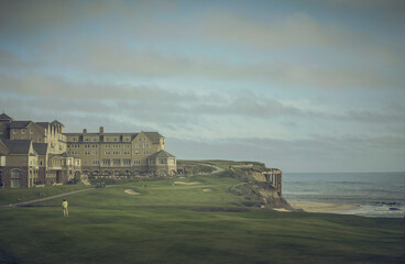 Golf course next to the ocean.