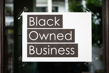 Canvas Print - Black owned business sign attached on the window