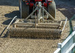 Close up of a tractor preparing the Field before an Equestrian competition in Italy