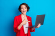 © deagreez - Portrait of attractive cheerful lady freelancer holding in hand laptop showing web education isolated on bright blue color background