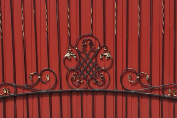 Canvas Print - black red texture of iron forged rods in the pattern on the metal wall of the fence