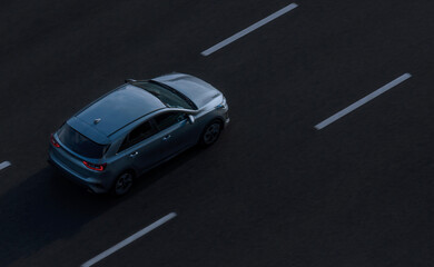 Saint Petersburg, Russia - July 25, 2020: Top view of one car on an empty road photographed from a height