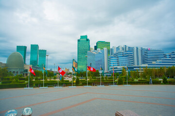 Kazakhstan, Astana: The Capital Of Kazakhstan - Astana. Baiterek. empty scuare with many flag