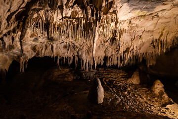 Illuminated picturesque karst rock formations in Balcarka Cave, Moravian Karst, Czech: Moravsky Kras, Czech Republic