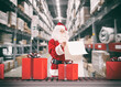 © alphaspirit - Santa Claus busy with the orders of Christmas gifts in a warehouse
