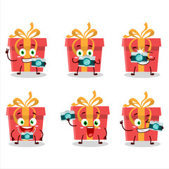 Poster - Photographer profession emoticon with red christmas gift cartoon character