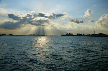 Wall Mural - View of the ocean at sunset in Singapore from a cruise ship