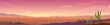 Panoramic view of a desert sunset. A wide view of a large landscape with some vegetation.