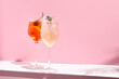 Aperol Spritz Cocktail on pink background