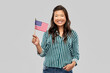 © Syda Productions - independence day, patriotism and national people concept - happy asian woman with flag of america over grey background