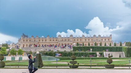 Wall Mural - Famous palace Versailles with beautiful gardens timelapse. The Palace Versailles was a royal chateau. It was added to the UNESCO list of World Heritage Sites. Paris, France.