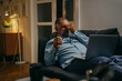 © cherryandbees - middle aged man feeling tired and sleepy while laying on sofa at his home
