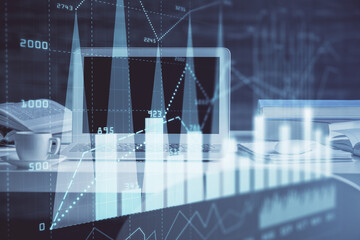 Stock market graph and table with computer background. Double exposure. Concept of financial analysis.