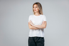 Stylish Blonde Girl Wearing White T-shirt Posing In Studio