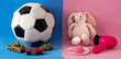Gender stereotype toys on blue and pink background