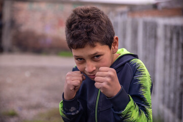 Wall Mural - Portrait of little gypsy boy ready for fight 