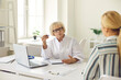 © Studio Romantic - Mature professional woman doctor talking and explaining something to young woman patient