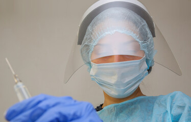 young woman doctor nurse in protective mask on white background