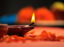 Extreme Close Up Of Traditional Diwali Lamp. Diwali Celebration Background Or Hindu Festive Background With Burning Earthen Light. 