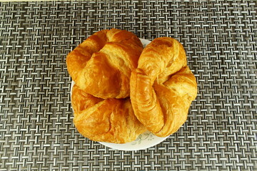 Wall Mural - fresh home made traditional croissant bread shoot under soften diffuse light