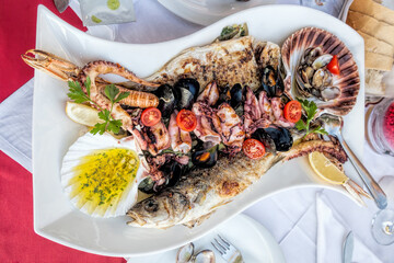 Amazing seafood plate with fish, scallops, prawns, octopus