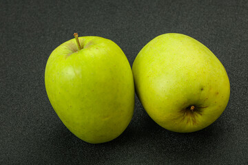 Two ripe green sweet apples