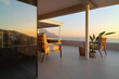 © Trevor Adeline/Caia Image - Luxury home showcase patio with tranquil sunset ocean view