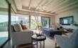 © Trevor Adeline/Caia Image - Home showcase interior living room with wood beam ceiling