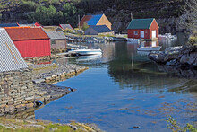 Boats And Buildings Of Fishing  Village Of Oygarden, Norway On Outgoing Tide