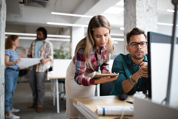 Company employees working in software development and designer office