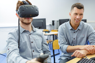 young man in technology lab using virtual reality headset