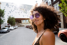 Portrait Confident Beautiful Woman In Sunglasses On Sunny City Street