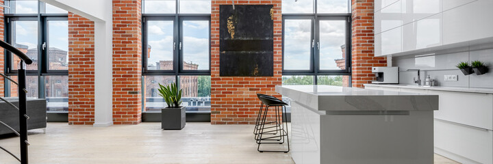 Kitchen in apartment with big windows, panorama