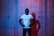 © Javier D√≠ez/Stocksy - Serious confident ethnic man in neon light