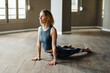 © Javier D√≠ez/Stocksy - Woman performing during yoga training