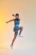 © Javier D√≠ez/Stocksy - Fit lady jumping during training