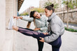 © Javier D√≠ez/Stocksy - Young sportswoman in active wear warming up to train at city str